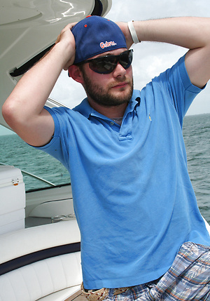 Amateur American Chris has fun on a boat when he plays with his massive power tool