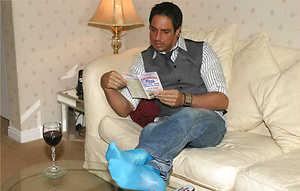 Marcello relaxes with a glass of red wine and his firm cock in his hand