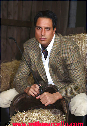 Marcello dressed in full riding suit masturbating in the stables