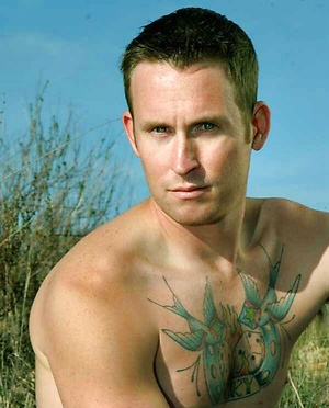 Tattooed hunk Chris posing naked
