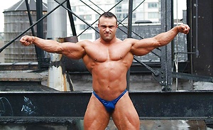 Ripped bodybuilder Johnny Bravo shows his amazing form in tight shorts and skimpy undies