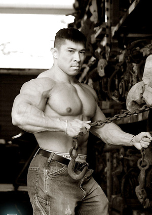 Muscled asian man Daryl Gee posing
