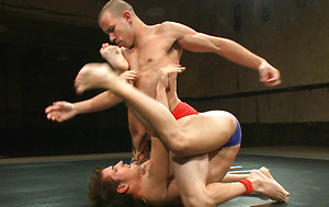 A professional cage fighter wrestles a big-dicked stud for the right to pound his sweet hole.