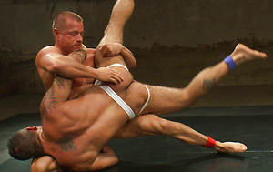 Two hot, hung studs wrestle for the right to a brutal victory fuck that will leave the loser's ass sore and in shame.