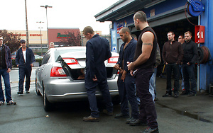 Spencer Reed and a bunch of car mechanics take turns fucking Gianni Lucca in a public auto garage.