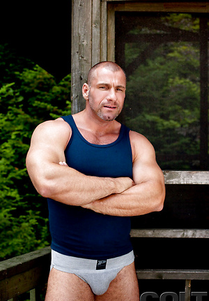 Mature bodybuilder posing naked by Colt Studio image 1