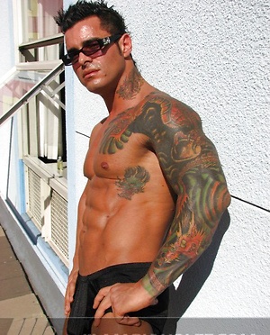 Jock poses outside and jerks off on bed