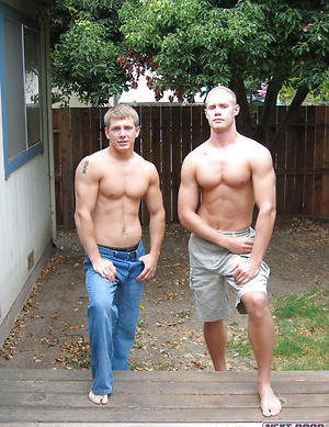 Workout buddies Nick and Tommy D pose together naked on the couch