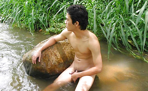 Sexy Thai guy strips in the wild