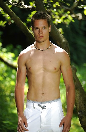 Cute boy posing naked outdoors