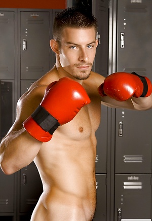Mike Roberts posing in a locker room