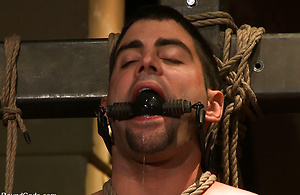 Justin Ryder has nowhere to go in bondage, as Josh West dominates his throat and asshole