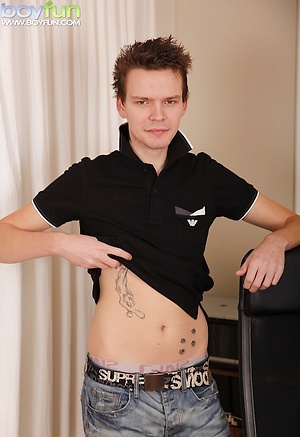 Tattooed Joseph Miliardo busts a nut onto his stomach.