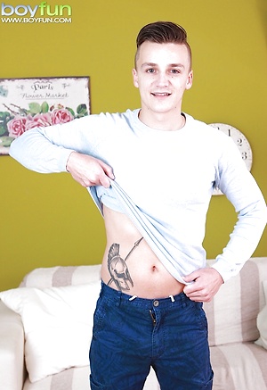 Tattooed Dom Ully busts a big nut over his stomach.
