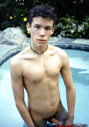 Cute twink blows a hot creamy load all over himself pool side.