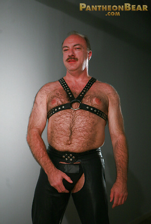 Jeremy Todd in a lether gear strokes his uncut mature cock by Pantheon Bear image 2
