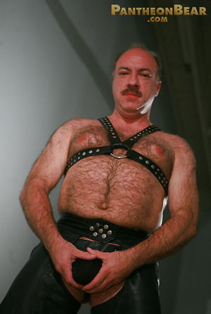 Jeremy Todd in a lether gear strokes his uncut mature cock by Pantheon Bear image 5