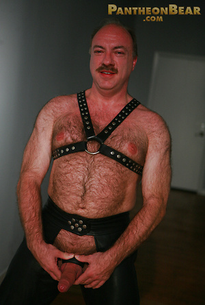 Jeremy Todd in a lether gear strokes his uncut mature cock by Pantheon Bear image 14