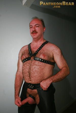 Jeremy Todd in a lether gear strokes his uncut mature cock by Pantheon Bear image 18