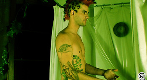 Punk With Mohawk and Tats Rubs in the Tub
