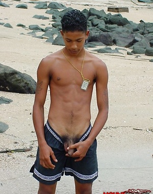 Two cute twinks at the beach sucking cock and fondling each other.