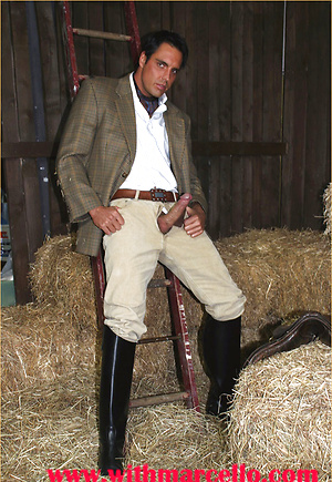 Marcello dressed in full riding suit masturbating in the stables