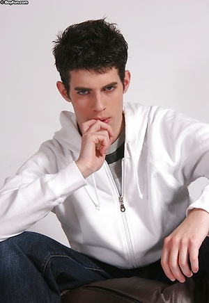 Cute twink Daniel masturbates on a bean bag chair.