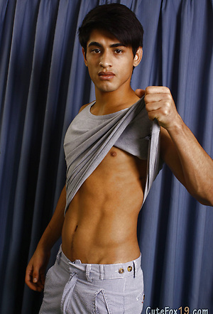 Good-looking twink posing at the studio